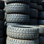 Variety of tires stacked in a tire shop.