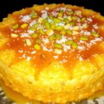 Delicious kunafa dessert with syrup and nuts on platter.